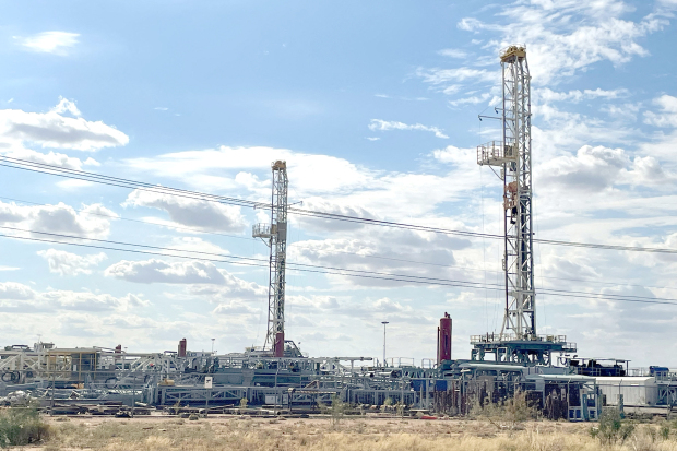 Oil falls from multi-month highs as tech stocks lift Wall Street